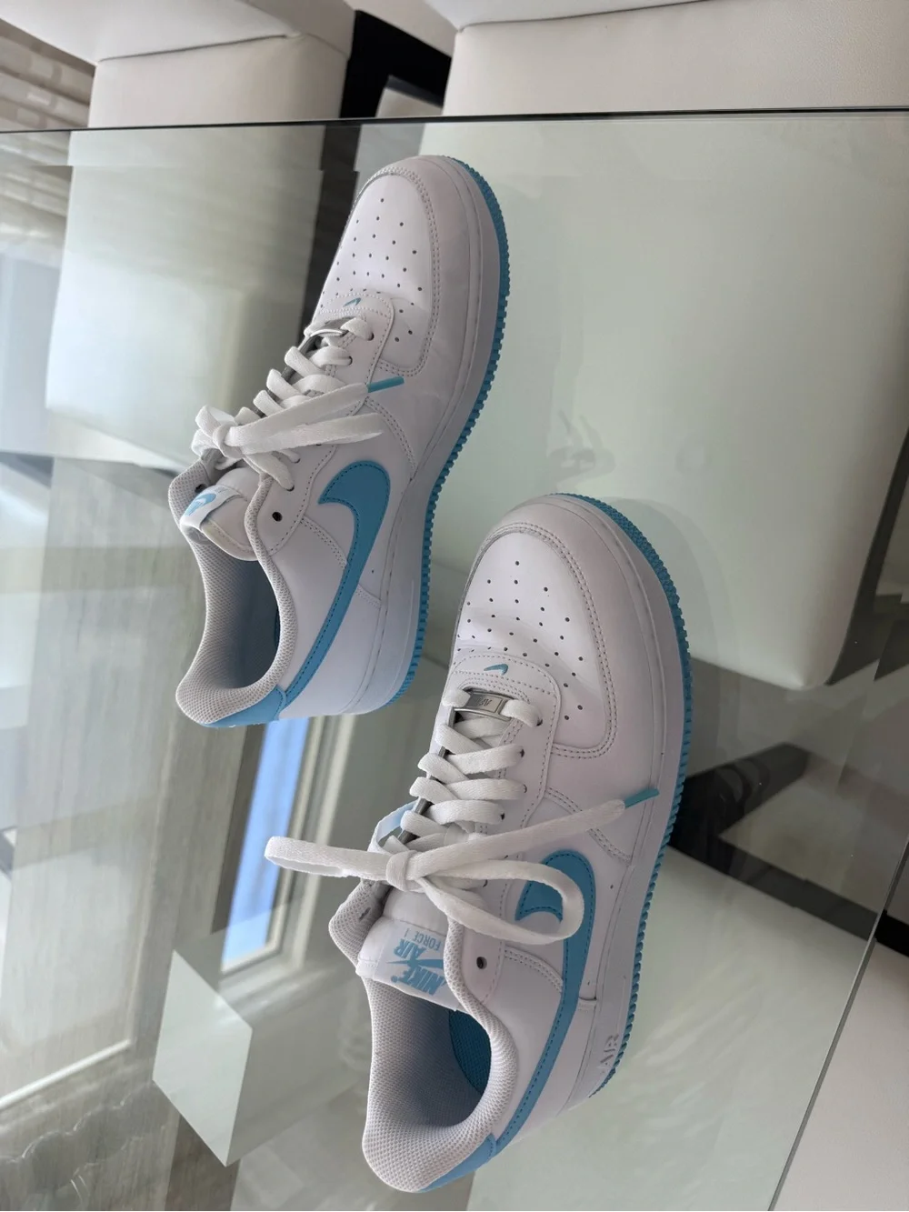 Nike White Low-Top Sneakers with Light Blue Swoosh